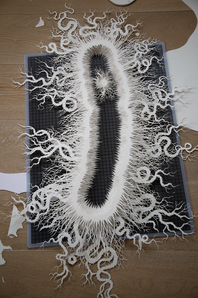 Illustration for article titled This haunting bacteria is actually an intricate hand-cut paper sculpture